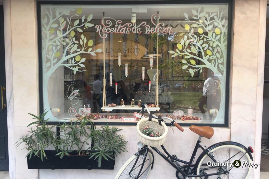 Bike in front of cute shop.