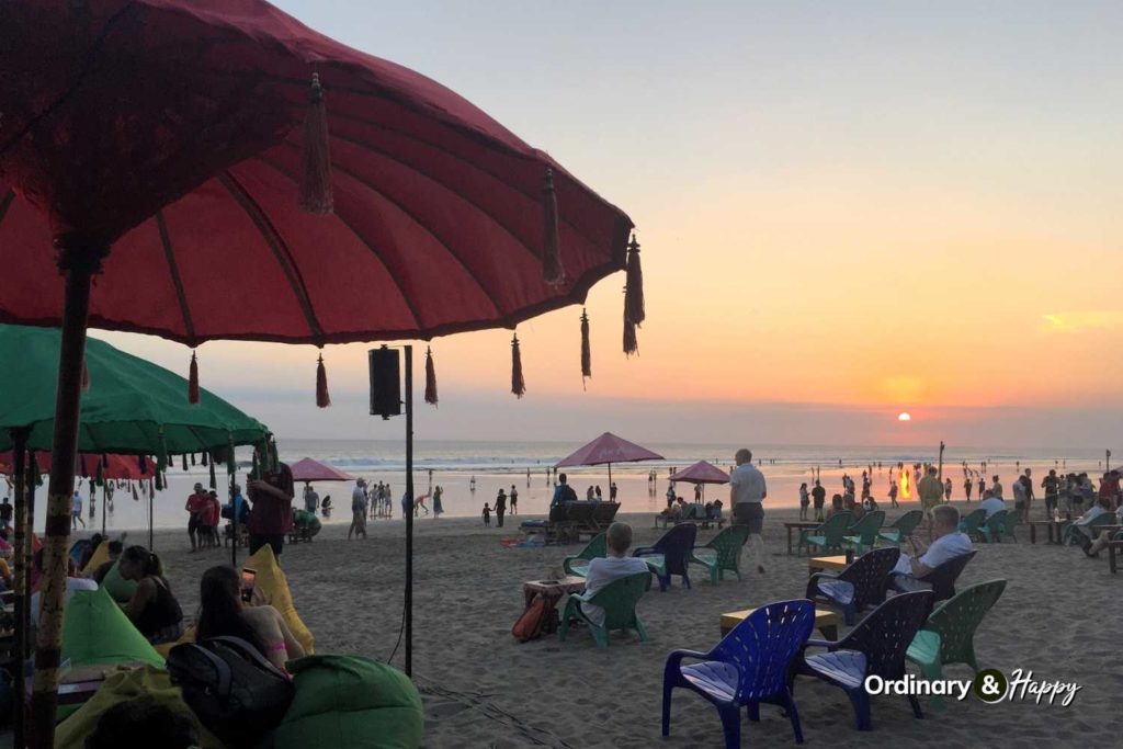 Busy beach bar at sunset.