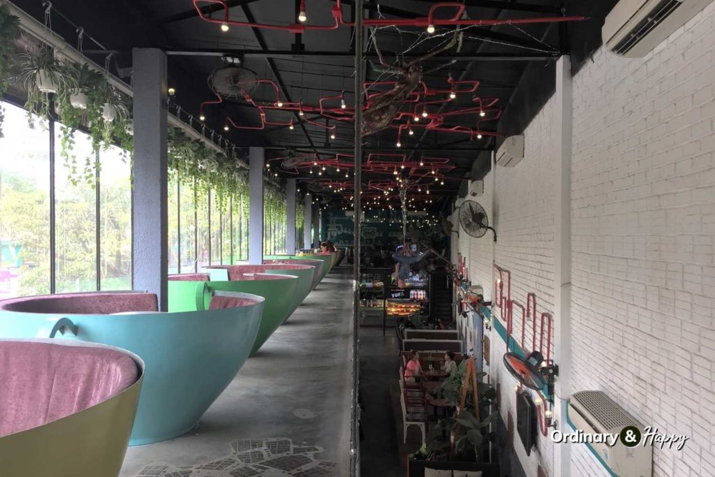 Coffee shop with booths in the shape of tea cups.