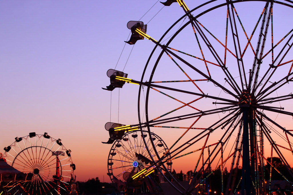 Ferris wheels at sunset.