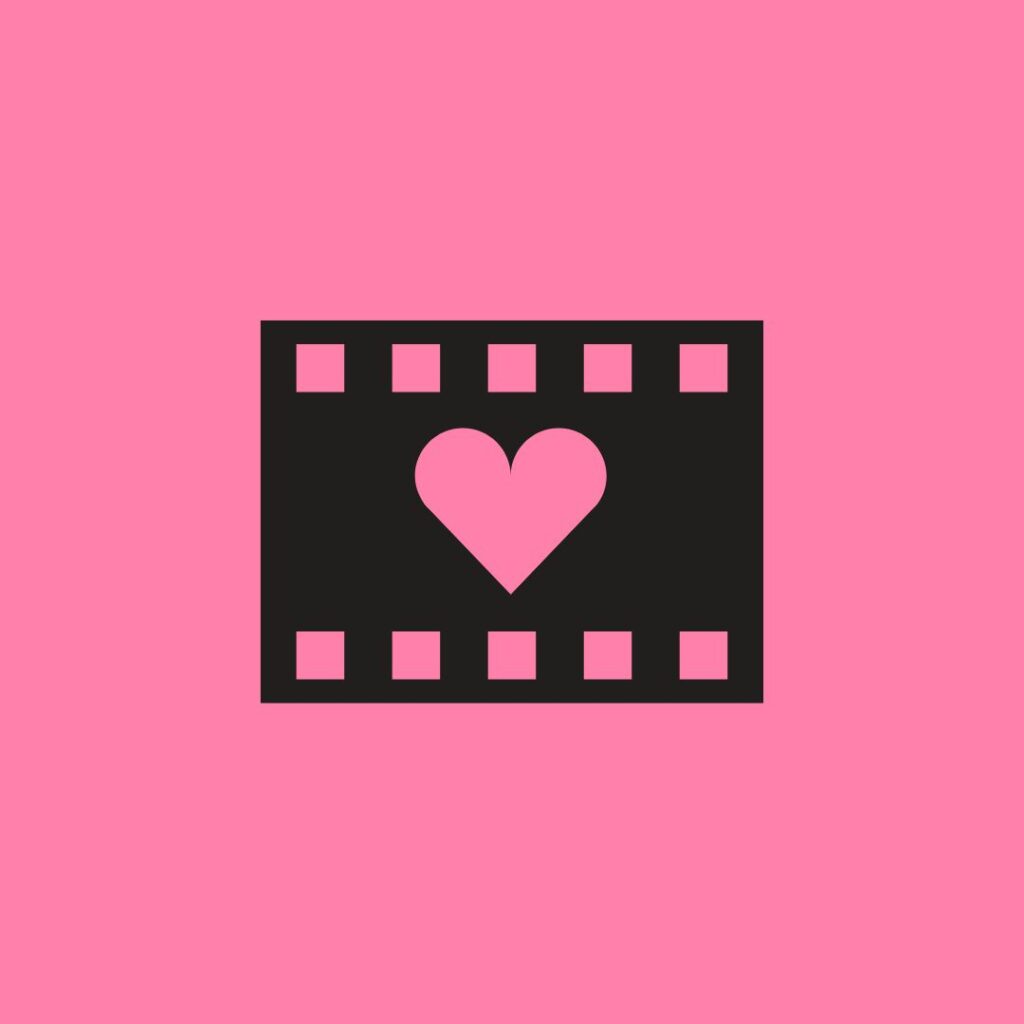 heart on a black film reel on a pink background