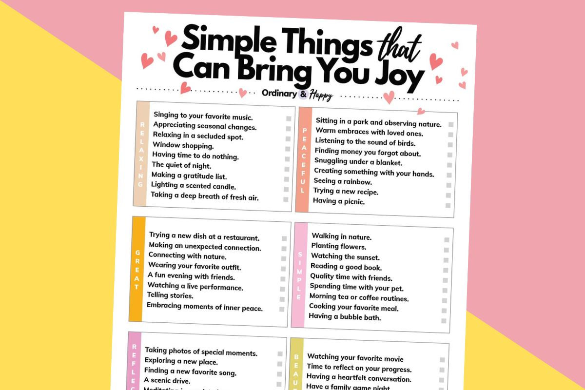 a partially visible list of over 50 ideas for simple things that can bring you joy on a white sheet against a 2-color pink and yellow background