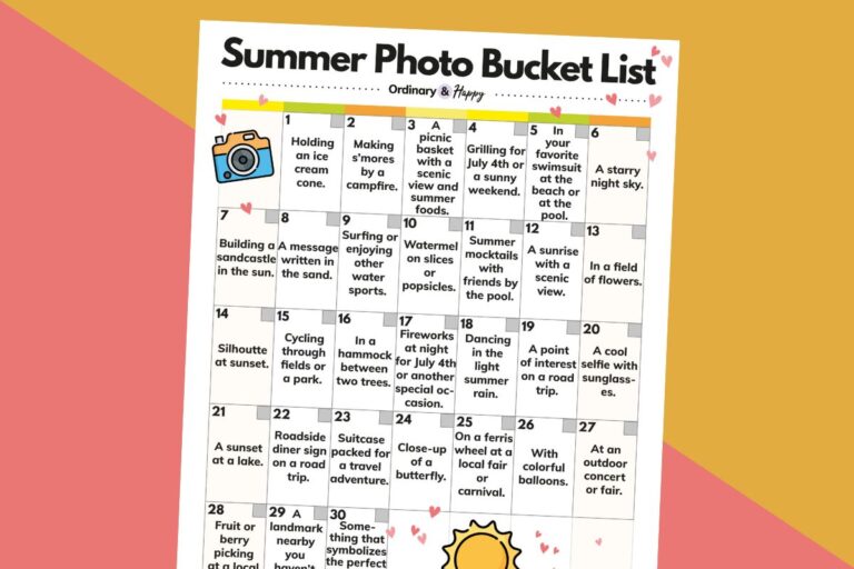 partially visible bingo card of summer photo bucket list ideas on a 2-color orange and red background
