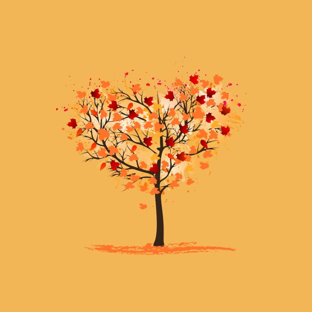heart-shaped tree with colorful fall leaves against an orange background