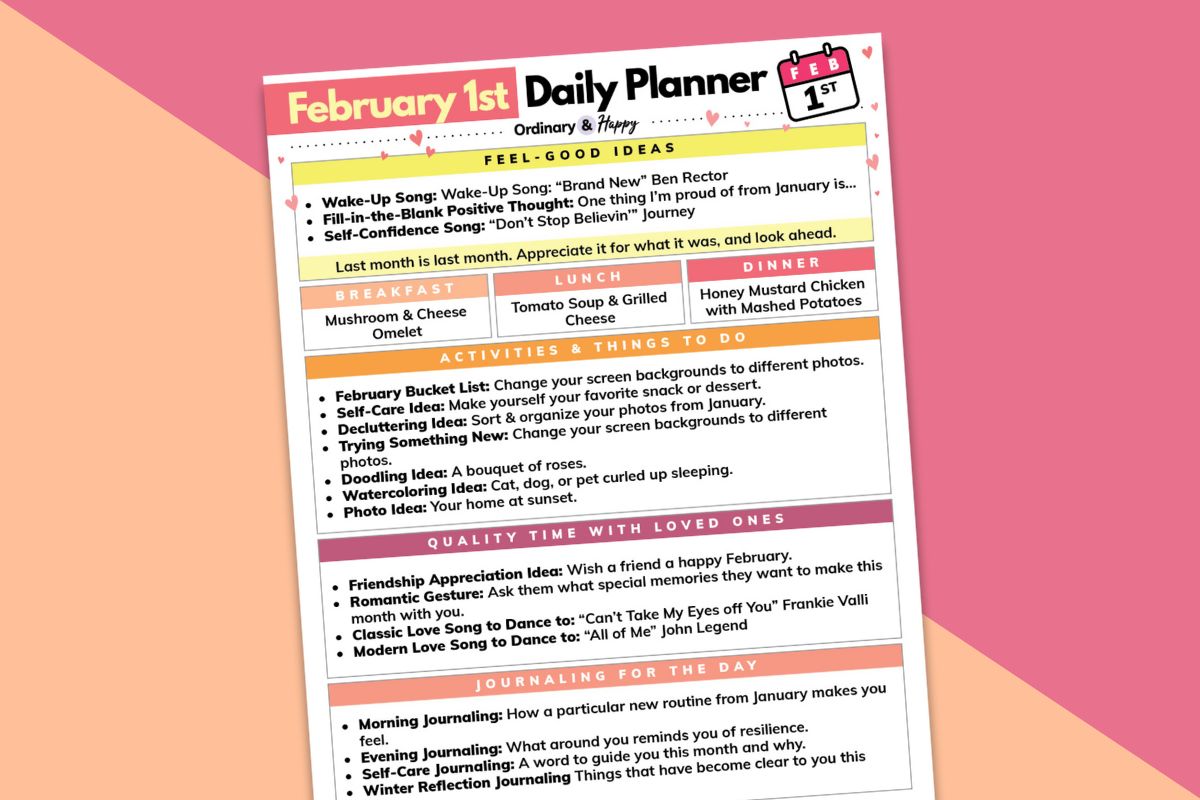 february 1st daily planner printable tilted to the left laid out on a block color orange and red background
