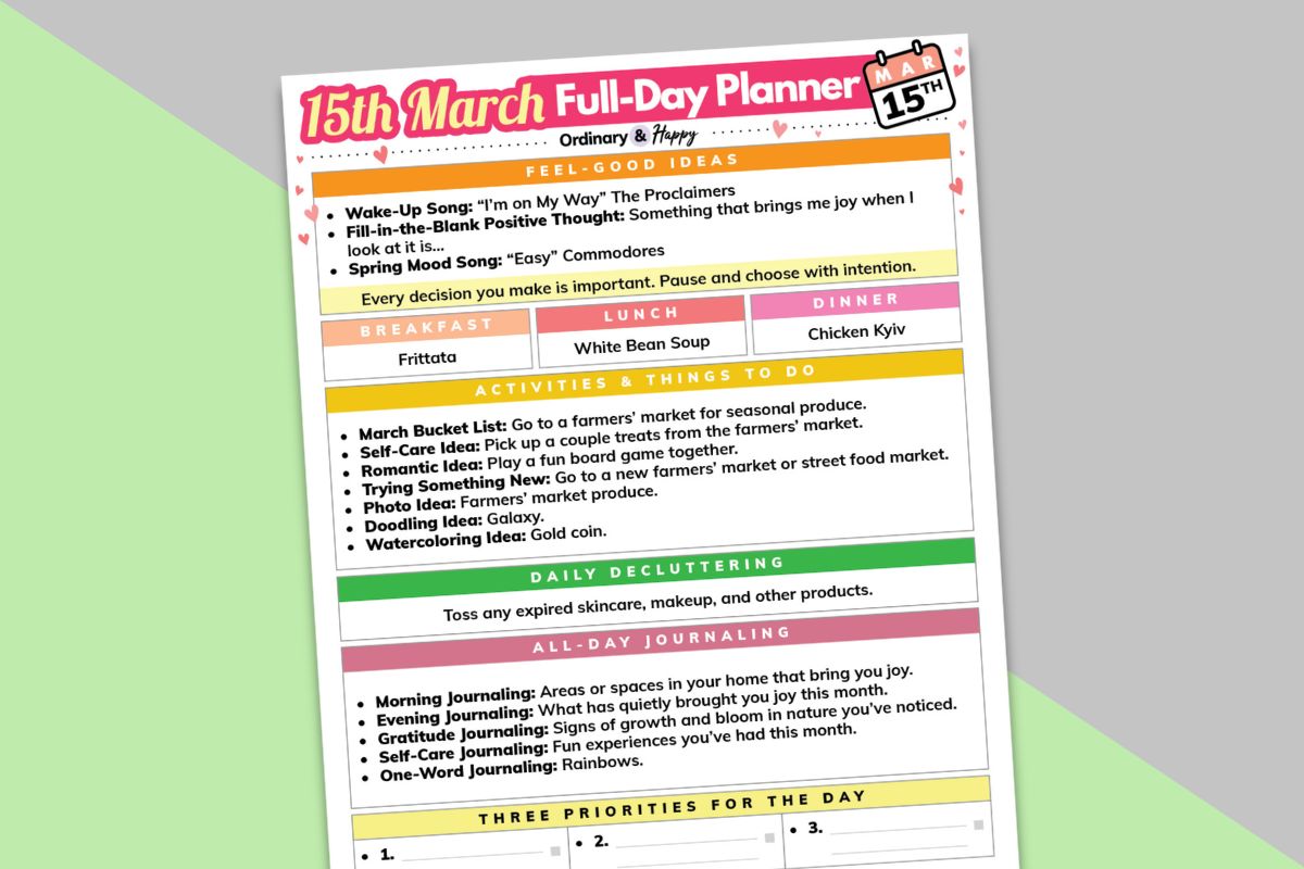 march 15th daily planner partially visible and tilted to the left displayed on a block color diagonal light green and red background