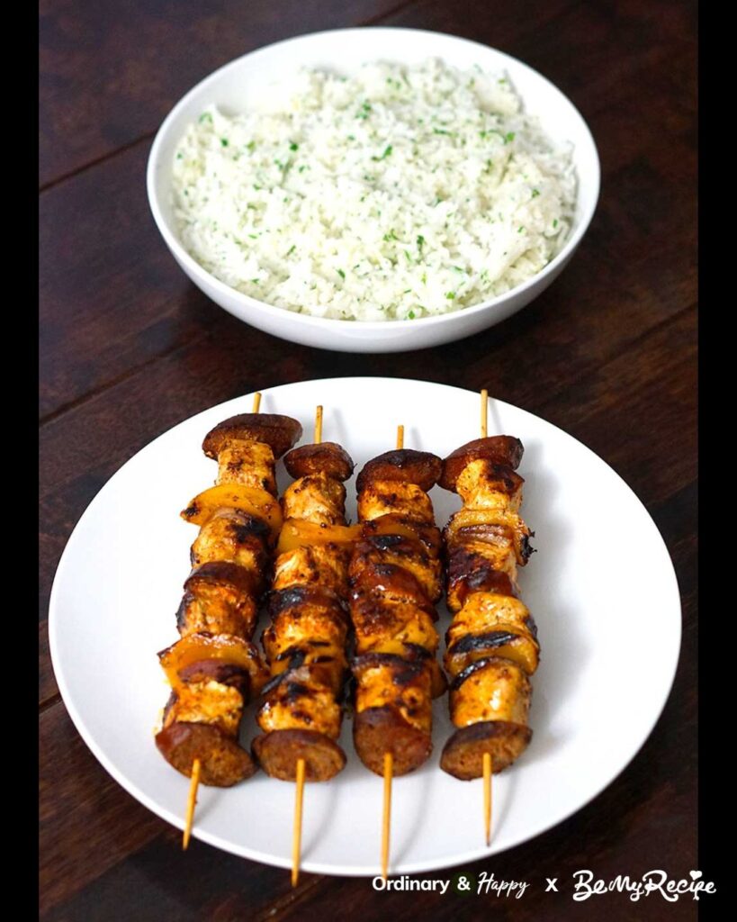Chicken chorizo skewers and lemon parsley garlic rice.